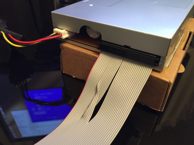 Twisted side of the cable plugged to the drive with colored wire to the left